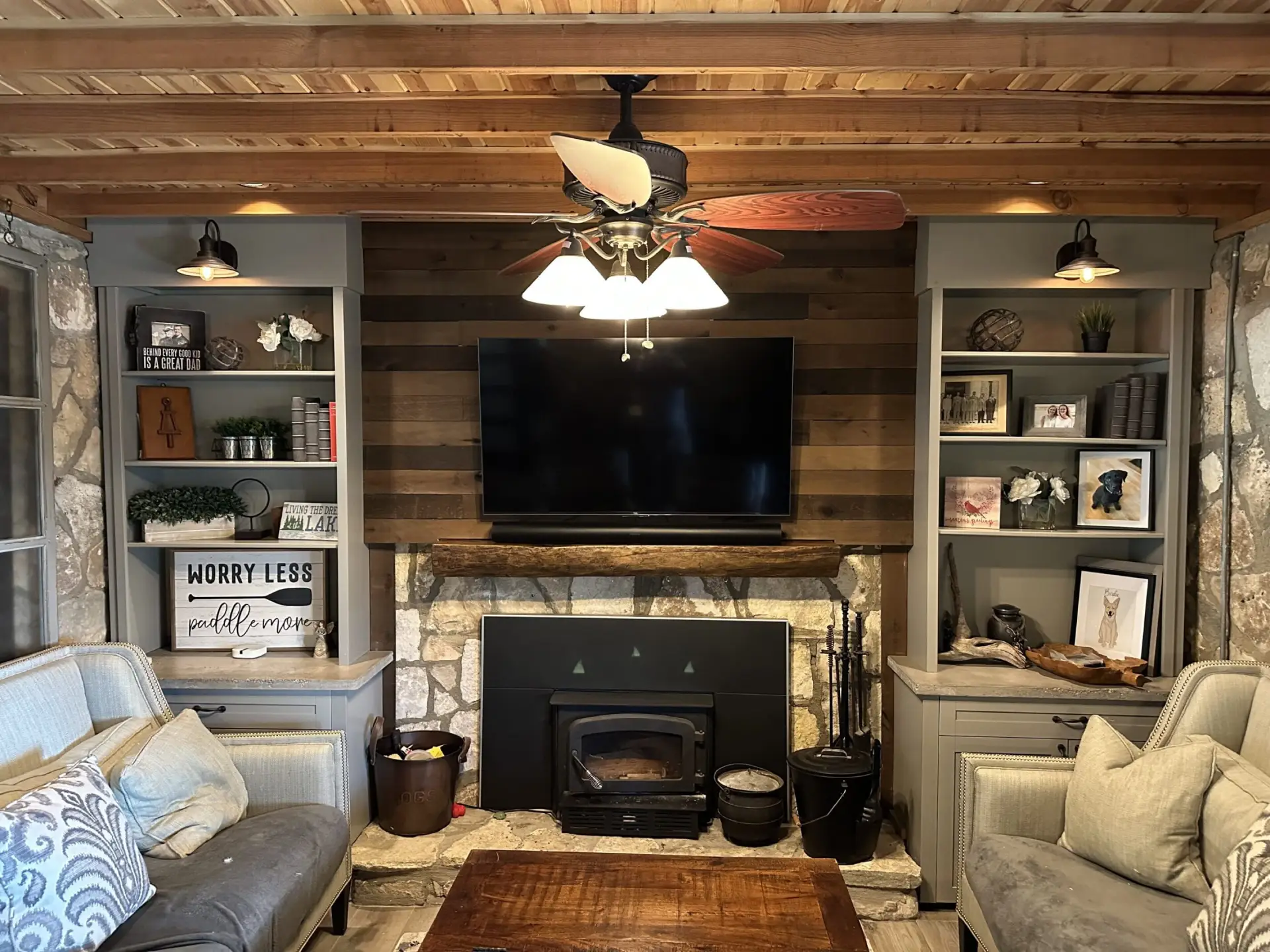 Cozy living room with fireplace and TV.