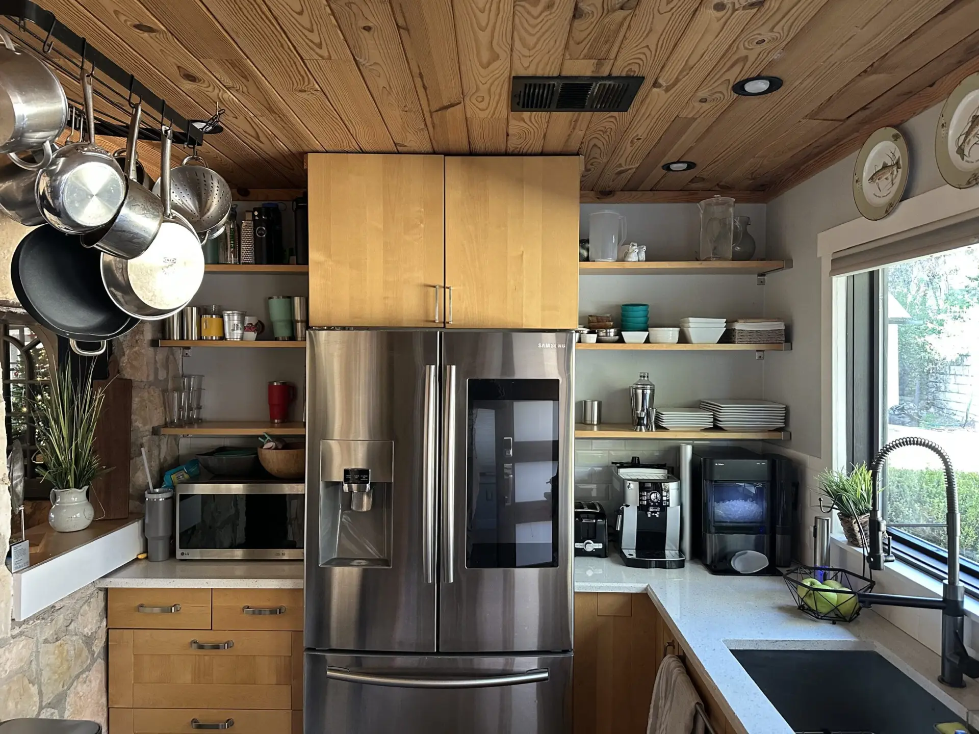 Modern kitchen with stainless steel appliances.
